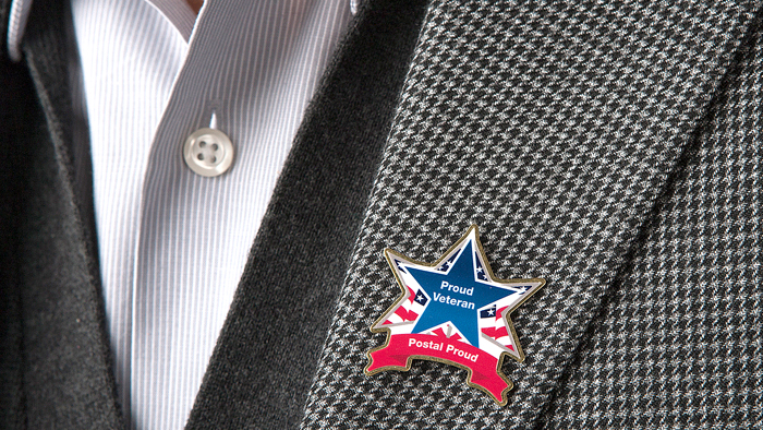 USPS is distributing lapel pins to employees who served in the armed forces.