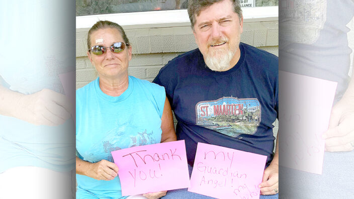 Rolla, MO, Rural Carrier Debra Grace-Sims with postal customer Melvin Blake