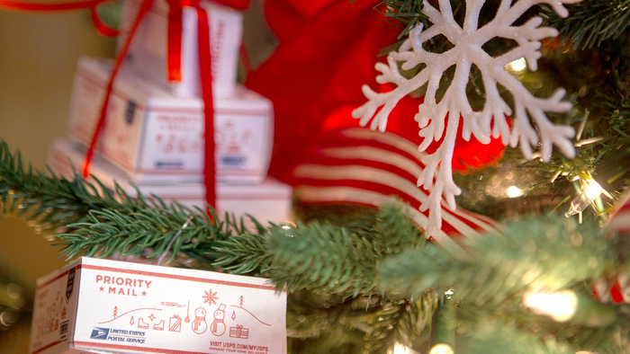 The Christmas tree in PMG Megan J. Brennan’s office is decorated with Priority Mail ornaments.