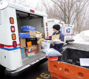 North Tonawanda, NY, Letter Carrier Emily Skuce loads her LLV before beginning her deliveries Dec. 22.