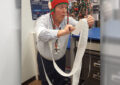 Occidental, CA, Retail Associate David Goyes reviews a receipt after ringing up more than 100 holiday parcels.