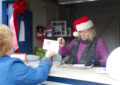 Bethlehem, PA, Retail Associate Tracey Wigg serves customers at a temporary station outside the main Post Office.