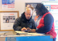 Carol Stream, IL, Retail Associate Latonia Hurt uses her mobile Point of Sale (mPOS) device to help a customer Dec. 19.