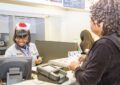 Los Angeles Retail Associate Yvette Porter helps a customer with shipping Dec. 19.