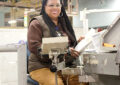 Tammy Wilson operates an Automated Parcel and Bundle Sorter at the Chicago Network Distribution Center.