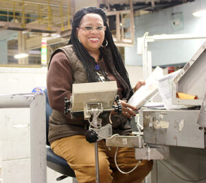 Tammy Wilson operates an Automated Parcel and Bundle Sorter at the Chicago Network Distribution Center.
