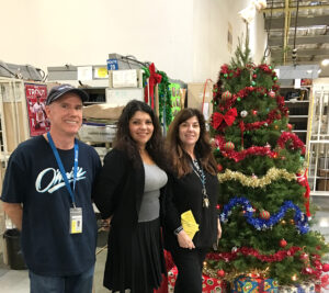 Employees working to deliver the holidays at the Westminster, CA, Post Office include, from left, Clerk Brian McGinley, Postmaster Ingrid Valenzuela and Supervisor Regina Lyon.