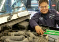 Arturo Blor, an automotive technician at the Suburban Maryland Processing and Distribution Center, helps keep delivery vehicles moving during the holidays.