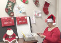 Clerk Sunny Wirth plays the role of Mrs. Claus while answering letters to Santa Claus at the San Antonio, TX, General Mail Facility.