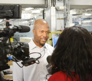 Dupree Cypress, distribution operations manager at the Suburban Maryland Processing and Distribution Center, answers a reporter’s questions about holiday shipping.