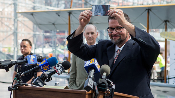 Man holds stamp