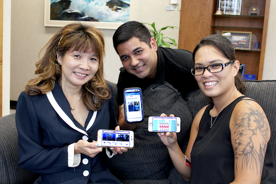 Employees displaying Link mobile homepage on their smartphones