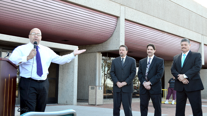 Retiring Phoenix Sr. Plant Manager Clyde Jones speaks at his flag presentation alongside, from left, Western Area VP Greg Graves, Arizona District Manager John DiPeri and Phoenix Postmaster Humberto “Junior” Trujillo.