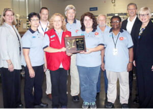 The gathering at the Toccoa, GA, Post Office featured, from left, Karen Wehunt, Joyce Kirby, Chris Murley, Shelia Mclain, Jimmy Whitmire, Cathy Ivester, Larry Mason, Trenace Richie, Acting Atlanta District Manager Russell Gardner and Sigmon.