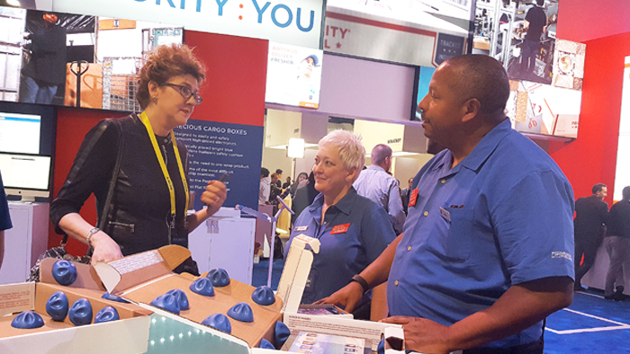 An attendee learns more about the Precious Cargo Boxes from Field Sales Representative Debra Bibb and Business Alliances Specialist Dana Foster at the recent Consumer Electronics Show in Las Vegas.