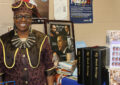 Free Union, VA, Postmaster Evette Barton stands near the display she created in her Post Office lobby.