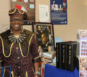 Free Union, VA, Postmaster Evette Barton stands near the display she created in her Post Office lobby.