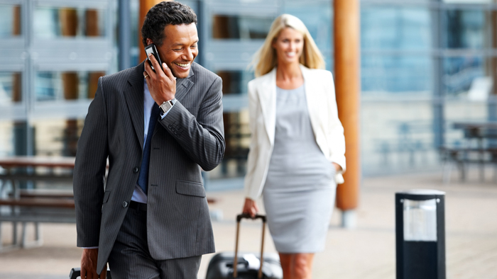 Man walking and talking on his mobile phone