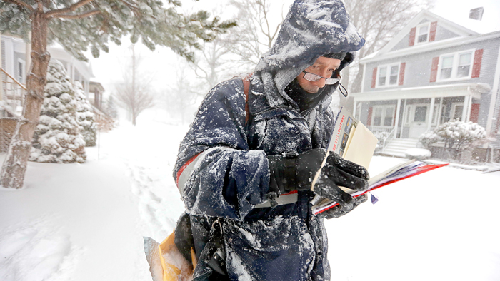 USPS employee in snow