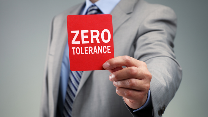 Zero tolerance sign in hand