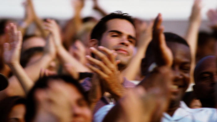 Men and women clapping hands