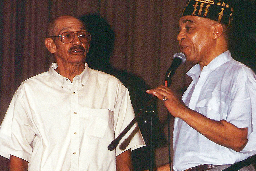 Two men on stage with microphone