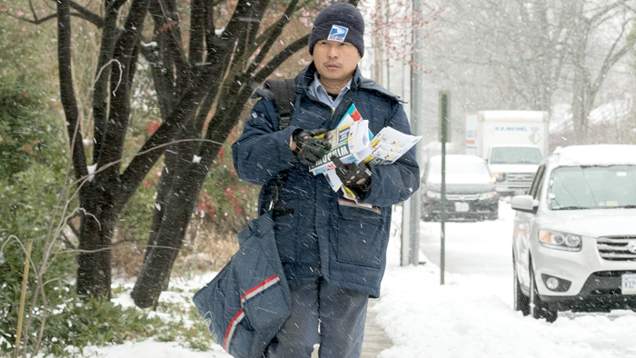 USPS letter carrier in snow