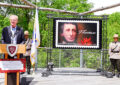 Man speaks at podium