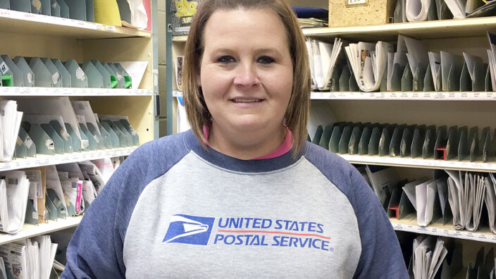 Woman with USPS logo sweatshirt