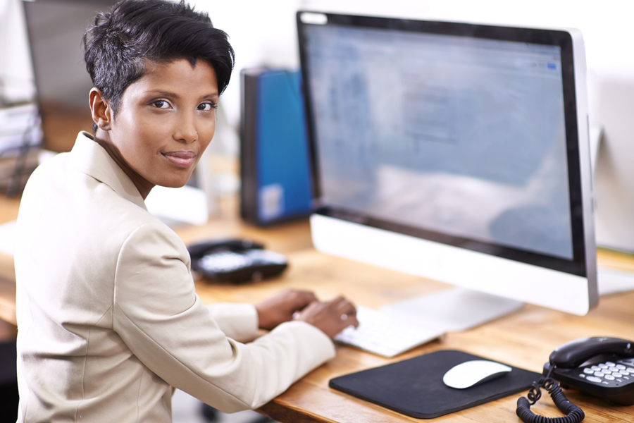 Woman seated at computer