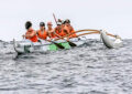 Canoe racers in water