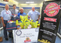 USPS employees near food drive display