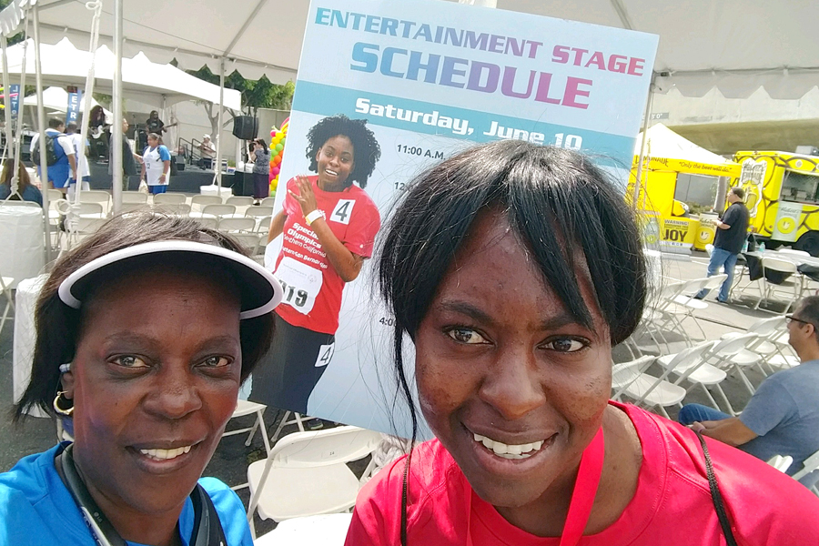 USPS employee and adult daughter at Special Olympics event