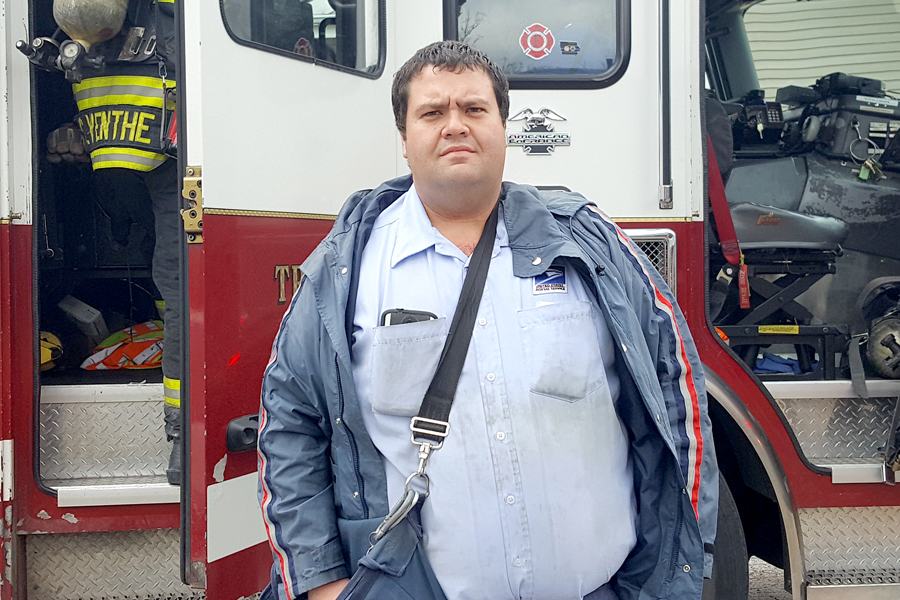Man stands in front of fire truck