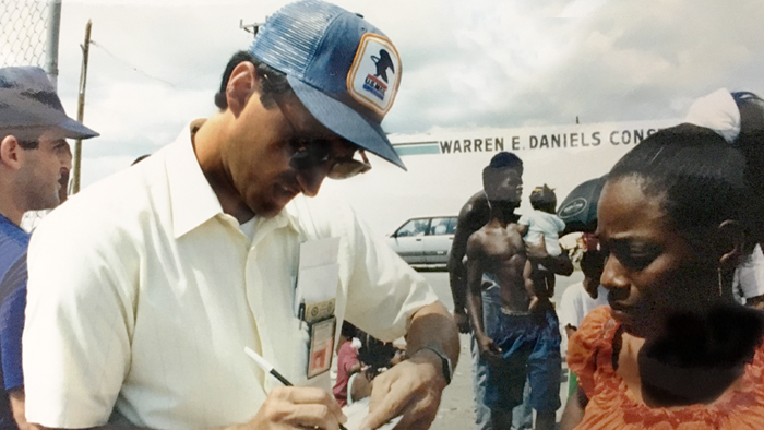 Employee assisting customer during Hurricane Andrew