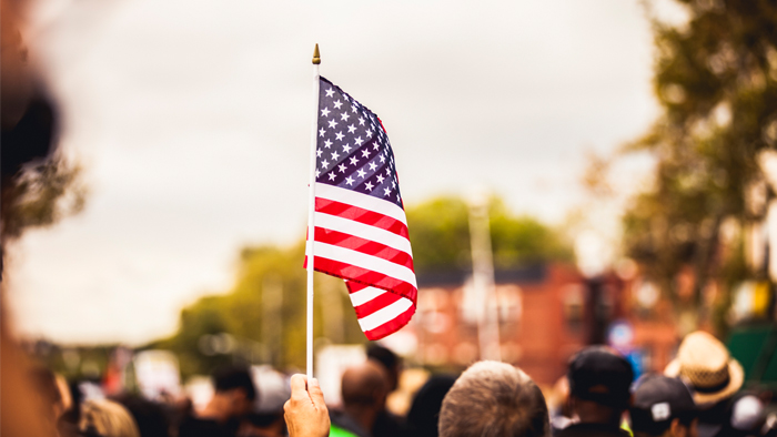 Child carrying American flag