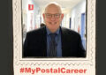 Schenectady, NY, Postmaster John Reilly poses for picture