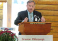 Man speaks at podium