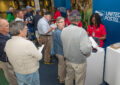 Customers line up at USPS stamp booth