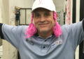 Man wears pink pigtails