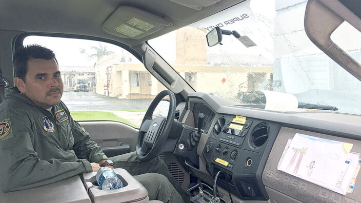 Master Sgt. Eric Circuns sits in a truck with a picture drawn by Iris.