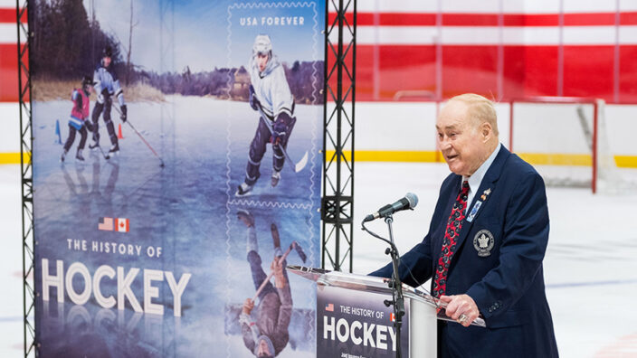 Red Kelley speaks at Hockey stamps dedication