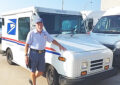 Man in carrier uniform next to LLV