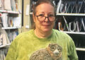 Woman in green shirt and glasses