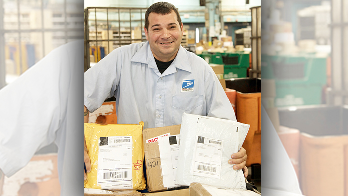 Employee posing with parcels