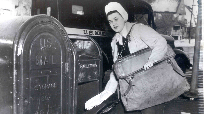 Black and white photo of woman with blue box