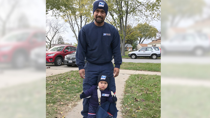 Letter carrier and his 10-month-old son