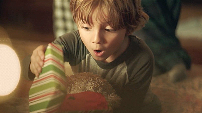 Surprised boy opens present