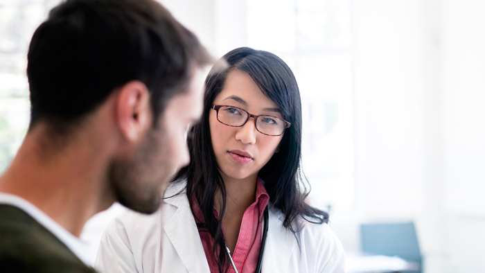 Doctor speaking with male patient