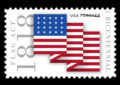 Folded American flag with "1818"